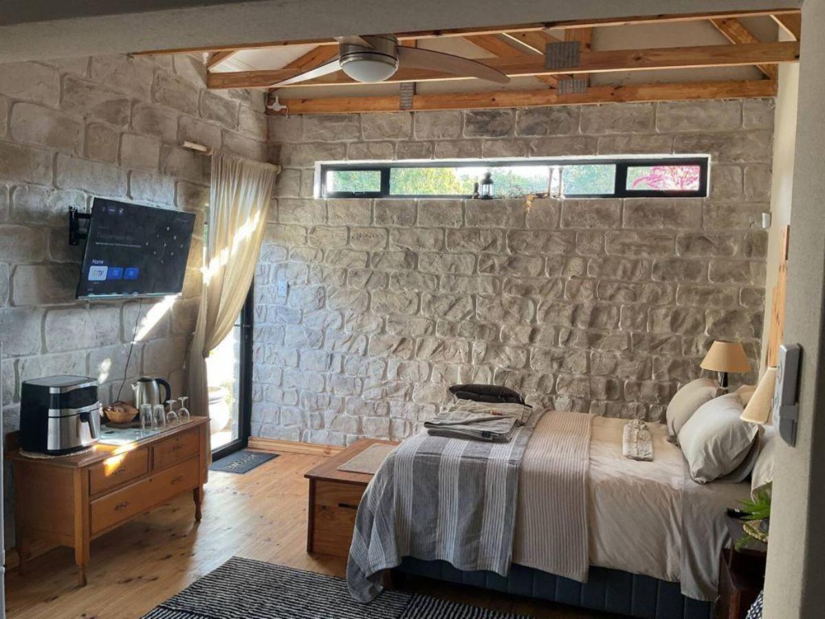 Business Suite with stone wall and TV