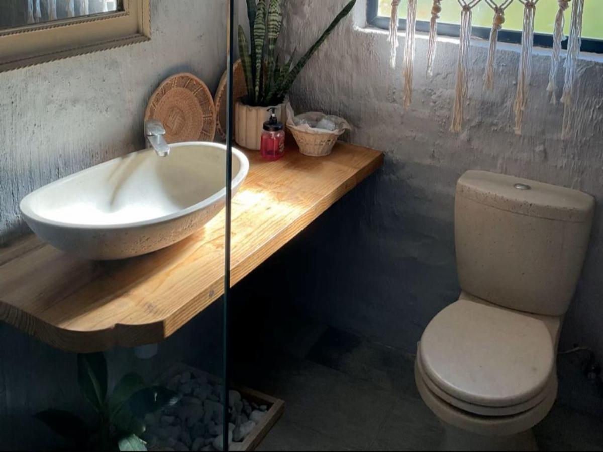Bathroom with oval basin and shower